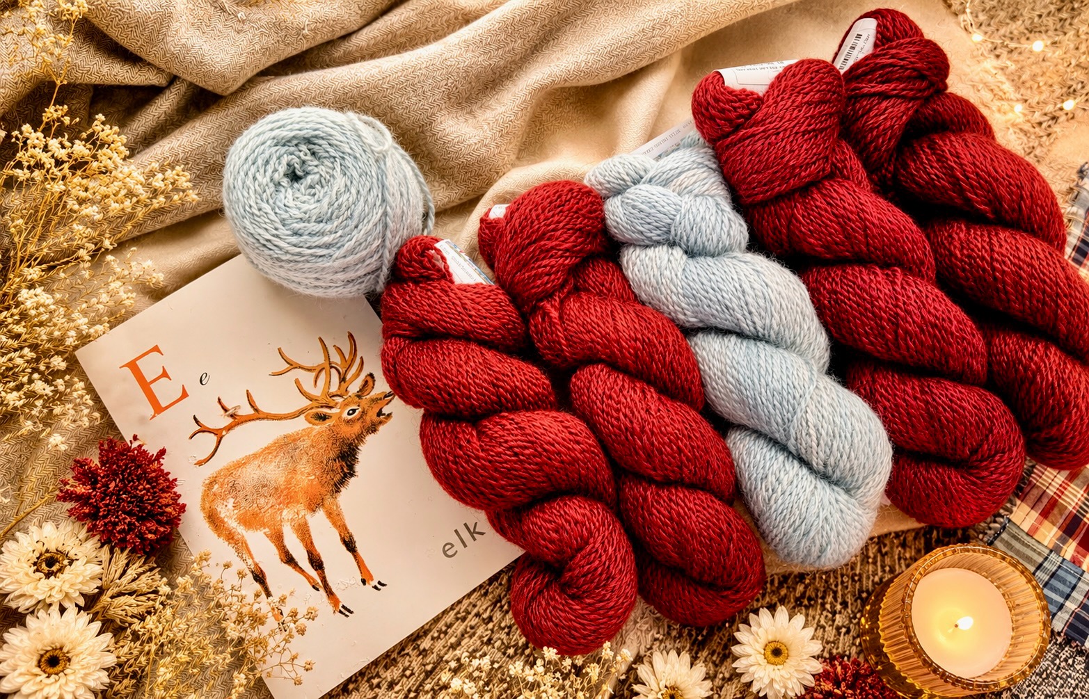 Curator's Cabinet — burgundy and grey hand-spun skeins beside a deer letter-card