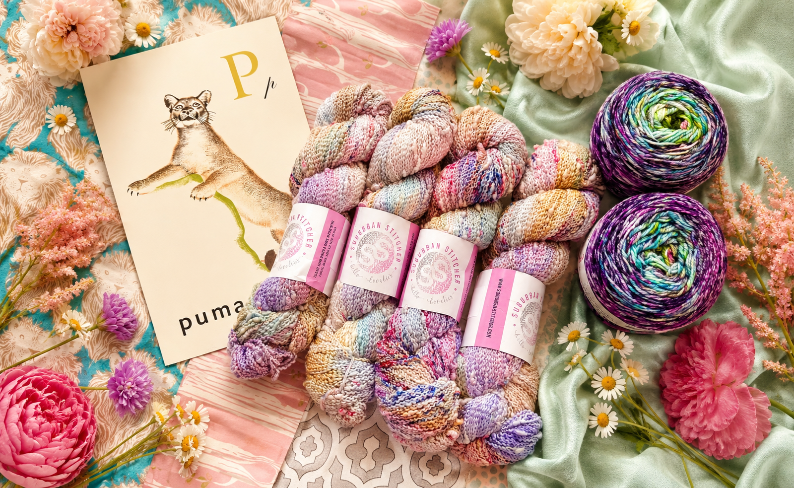 Luxury — cashmere and silk skeins with cream label cards and floral accents